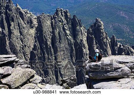 Woman on the summit of La Mira 2 341 m in the mountains of the Sierra de Gredos National Park At the bottom of the image the summits called Galayos Hoyos del Espino? vila Castilla y Le? n Spain View Large Photo Image Stock Image - Woman on the summit of La Mira 2 341 m in the mountains of the Sierra de Gredos National Park At the bottom of the image the summits called Galayos Hoyos del Espino? vila Castilla y Le? n Spain. Fotosearch