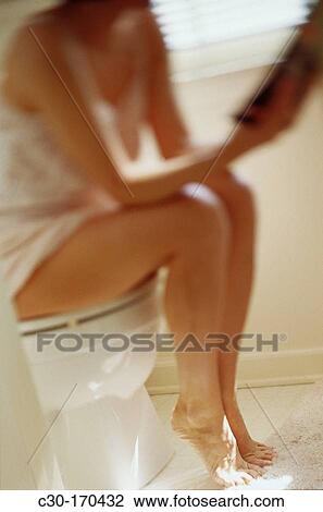 Woman on toilet View Large Photo Image Stock Image - Woman on toilet. Fotosearch
