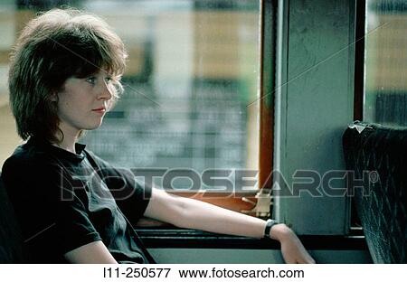 Woman on train View Large Photo Image Stock Photo - Woman on train. Fotosearch