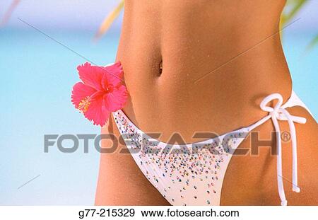 Stock Photo - Woman on tropical beach. Maldives Islands. Fotosearch