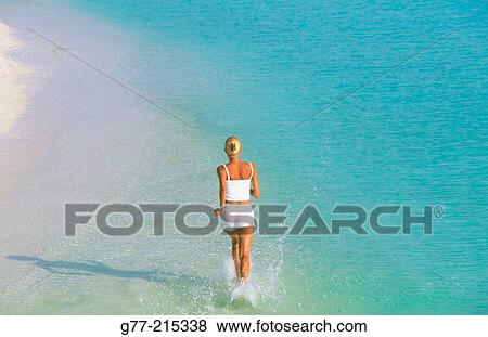 Woman on tropical beach. Maldives Islands View Large Photo Image Stock Photo - Woman on tropical beach. Maldives Islands. Fotosearch