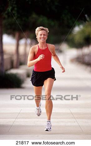 Woman out jogging View Large Photo Image Stock Photo - Woman out jogging. Fotosearch