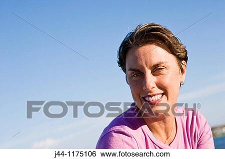 Woman outdoor, smiling, portrait View Large Photo Image Stock Photograph - Woman outdoor, smiling, portrait. Fotosearch