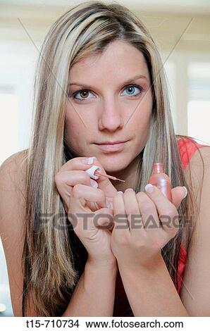 woman painting her finger nails View Large Photo Image Picture - woman painting her finger nails. Fotosearch