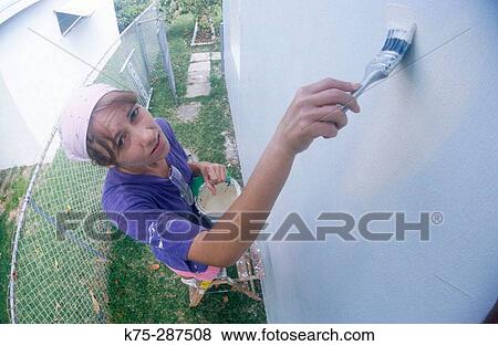 woman painting her house View Large Photo Image Stock Photo - woman painting her house. Fotosearch