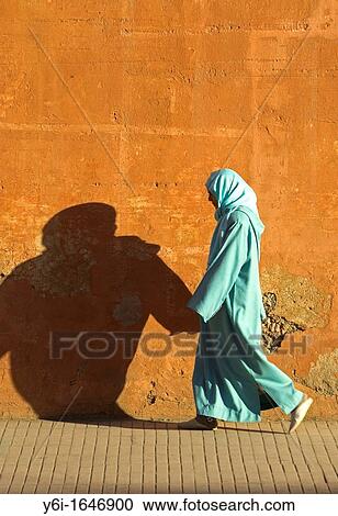 Woman pedestrian with shopping traditional clothing Rue Fatima Zohra Marrakech Morocco View Large Photo Image Stock Image - Woman pedestrian with shopping traditional clothing Rue Fatima Zohra Marrakech Morocco. Fotosearch