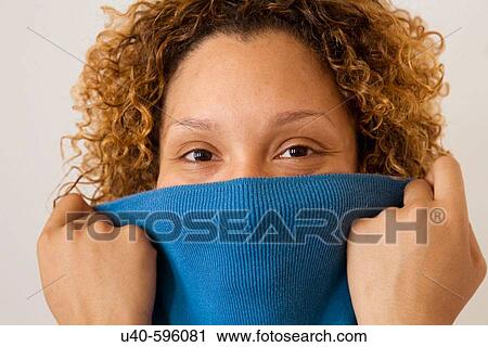 Woman peeking from behind sweater. View Large Photo Image Stock Image - Woman peeking from behind sweater.. Fotosearch