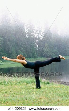 Woman performing yoga along Wark Lake. Ketchikan, Alaska. USA View Large Photo Image Stock Image - Woman performing yoga along Wark Lake. Ketchikan, Alaska. USA. Fotosearch