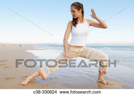 Picture - Woman performing yoga. Fotosearch