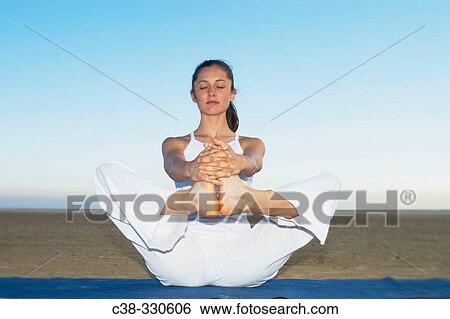 Woman performing yoga View Large Photo Image Stock Photograph - Woman performing yoga. Fotosearch