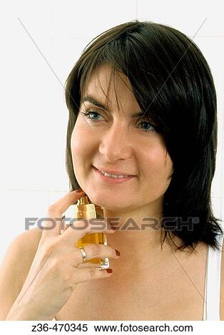 Woman perfuming View Large Photo Image Stock Photography - Woman perfuming. Fotosearch