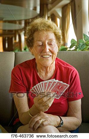 Stock Photograph - Woman playing cards. Fotosearch