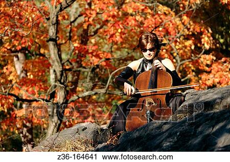 Stock Image - Woman playing cello. Fotosearch