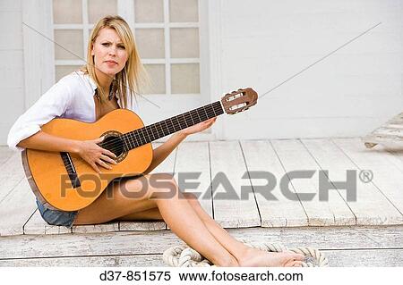 Woman playing guitar View Large Photo Image Stock Photography - Woman playing guitar. Fotosearch