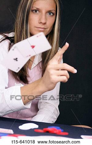 Woman playing poker throws away a perfect hand, pair of aces in the hole View Large Photo Image Stock Photo - Woman playing poker throws away a perfect hand, pair of aces in the hole. Fotosearch