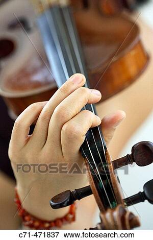 Stock Photo - Woman playing violin. Fotosearch