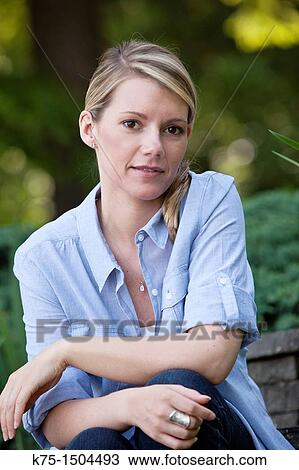 Woman portrait outdoors View Large Photo Image Stock Image - Woman portrait outdoors. Fotosearch