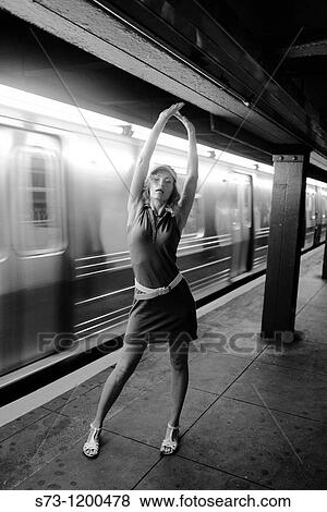 Woman poses in Manhattan subway, New York, USA View Large Photo Image Stock Photo - Woman poses in Manhattan subway, New York, USA. Fotosearch