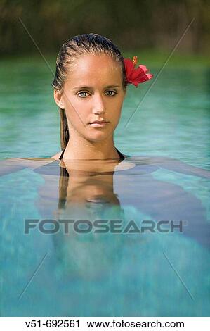 Woman posing at the swimming pool View Large Photo Image Stock Image - Woman posing at the swimming pool. Fotosearch