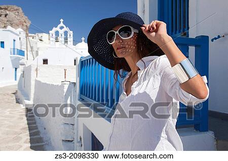 Woman posing in Chora near a church, Amorgos, Cyclades Islands, Greek Islands, Greece, Europe. View Large Photo Image Stock Image - Woman posing in Chora near a church, Amorgos, Cyclades Islands, Greek Islands, Greece, Europe.. Fotosearch