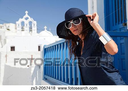 Woman posing in front of a church, Amorgos, Cyclades Islands, Greek Islands, Greece, Europe. View Large Photo Image Stock Photo - Woman posing in front of a church, Amorgos, Cyclades Islands, Greek Islands, Greece, Europe.. Fotosearch
