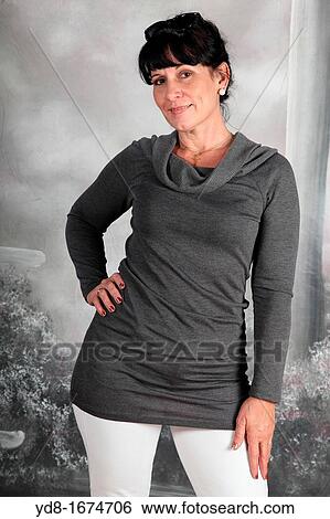 Woman posing in the Studio View Large Photo Image Stock Photograph - Woman posing in the Studio. Fotosearch