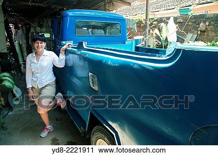 Woman posing next to a Jeep Willys de1949 renovated in Moron, Ciego de Avila, Cuba View Large Photo Image Stock Image - Woman posing next to a Jeep Willys de1949 renovated in Moron, Ciego de Avila, Cuba. Fotosearch