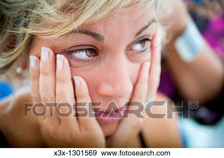 Woman posing with hands on her face View Large Photo Image Stock Photo - Woman posing with hands on her face. Fotosearch