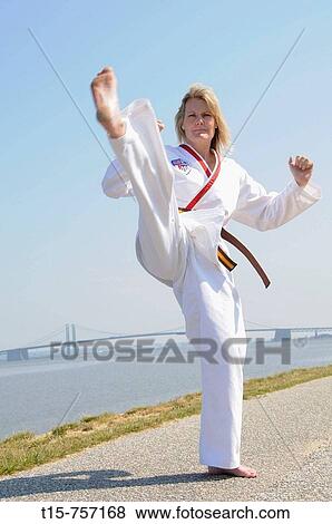 Stock Photo - woman practice karate routine. Fotosearch