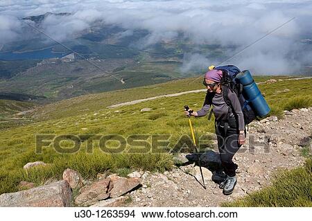 Woman practicing mountaineering in the Sierra de B? jar Natural Park, in Salamanca province, Biosphere Reserve of Sierra de B? jar and Francia View Large Photo Image Picture - Woman practicing mountaineering in the Sierra de B? jar Natural Park, in Salamanca province, Biosphere Reserve of Sierra de B? jar and Francia. Fotosearch