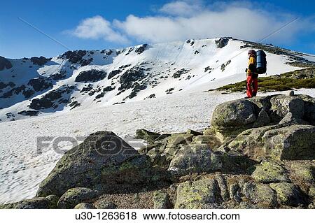 Stock Photo - Woman practicing mountaineering in the Sierra de B? jar Natural Park, in the provincial boundary between Salamanca and Avila, Biosphere Reserve of Sierra de B? jar and Francia. Fotosearch