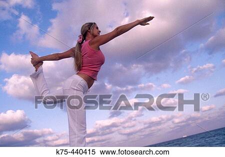 Woman practicing yoga at beach View Large Photo Image Stock Photography - Woman practicing yoga at beach. Fotosearch