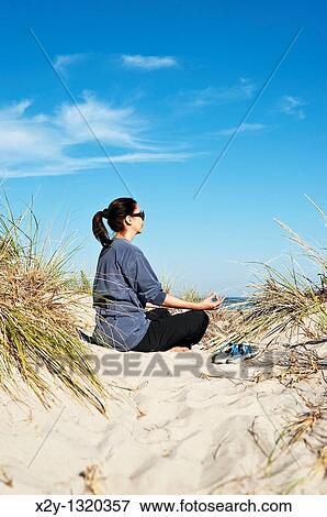 Woman practicing yoga at the beach, Cape Cod View Large Photo Image Stock Photo - Woman practicing yoga at the beach, Cape Cod. Fotosearch