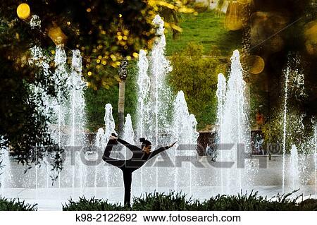 Woman practicing Yoga, Riera Park, Palma, Mallorca, Balearic Islands, Spain. View Large Photo Image Stock Image - Woman practicing Yoga, Riera Park, Palma, Mallorca, Balearic Islands, Spain.. Fotosearch