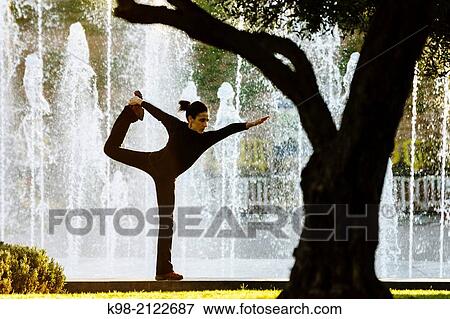 Woman practicing Yoga, Riera Park, Palma, Mallorca, Balearic Islands, Spain. View Large Photo Image Stock Photo - Woman practicing Yoga, Riera Park, Palma, Mallorca, Balearic Islands, Spain.. Fotosearch