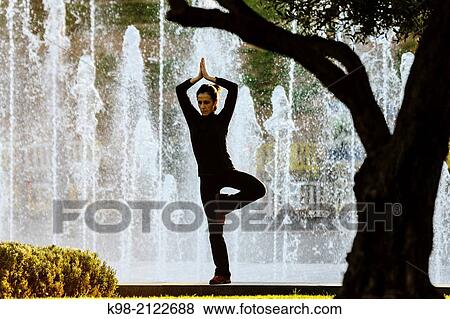 Woman practicing Yoga, Riera Park, Palma, Mallorca, Balearic Islands, Spain. View Large Photo Image Stock Photo - Woman practicing Yoga, Riera Park, Palma, Mallorca, Balearic Islands, Spain.. Fotosearch