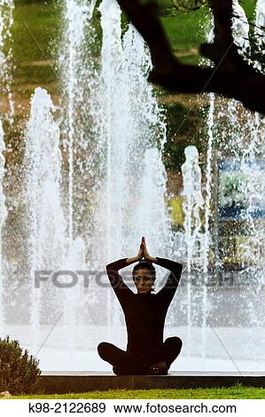 Woman practicing Yoga, Riera Park, Palma, Mallorca, Balearic Islands, Spain. View Large Photo Image Stock Photo - Woman practicing Yoga, Riera Park, Palma, Mallorca, Balearic Islands, Spain.. Fotosearch