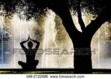 Woman practicing Yoga, Riera Park, Palma, Mallorca, Balearic Islands, Spain. View Large Photo Image Stock Photograph - Woman practicing Yoga, Riera Park, Palma, Mallorca, Balearic Islands, Spain.. Fotosearch