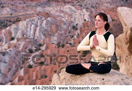 Stock Photo - Woman practicing yoga. Utah, USA. Fotosearch