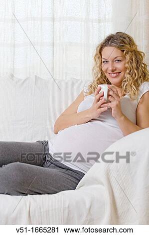 Woman, Pregnant, Healthy, Food & Drink, Couch, Smiling, Wellness, Blonde View Large Photo Image Stock Image - Woman, Pregnant, Healthy, Food & Drink, Couch, Smiling, Wellness, Blonde. Fotosearch