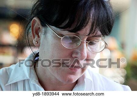 Woman reading a book View Large Photo Image Picture - Woman reading a book. Fotosearch