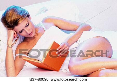 Woman reading a book View Large Photo Image Stock Photograph - Woman reading a book. Fotosearch