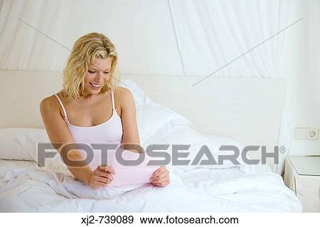 Woman reading a letter View Large Photo Image Stock Photo - Woman reading a letter. Fotosearch