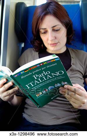 Stock Photograph - Woman reading an Italian language book. Fotosearch