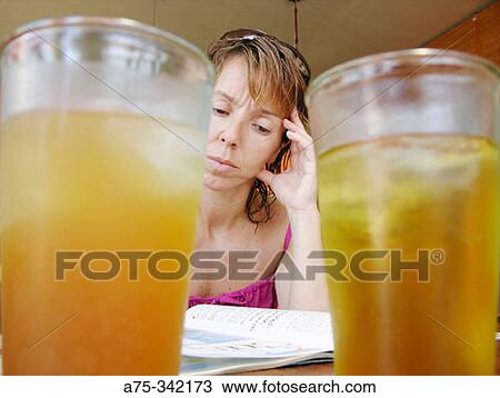 Woman reading in a Bar View Large Photo Image Stock Image - Woman reading in a Bar. Fotosearch