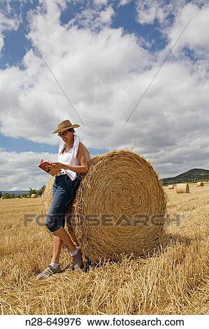 Woman reading in field. Villarcayo. Burgos province, Castilla-Le? n, Spain. View Large Photo Image Stock Photograph - Woman reading in field. Villarcayo. Burgos province, Castilla-Le? n, Spain.. Fotosearch