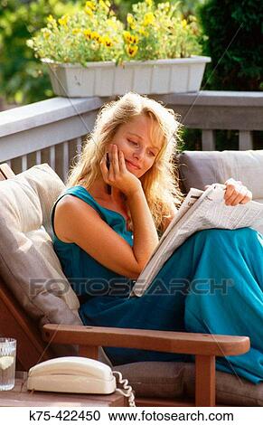 Woman reading newspaper View Large Photo Image Stock Image - Woman reading newspaper. Fotosearch
