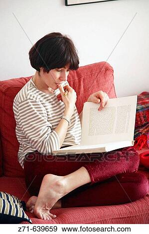 Stock Photo - Woman reading. Fotosearch