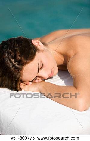 Woman receiving a massage by the sea View Large Photo Image Stock Photography - Woman receiving a massage by the sea. Fotosearch