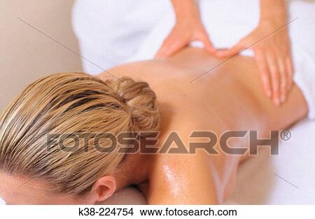 Woman receiving a massage View Large Photo Image Picture - Woman receiving a massage. Fotosearch